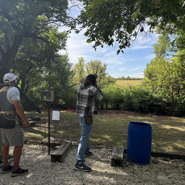 Two_men_shooting_clay_at_outdoor_range