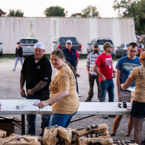 Crowd_of_people_at_sscdsg_event_with_tables_and_supplies