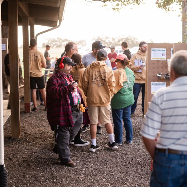 Crowd_of_people_gathered_under_tree