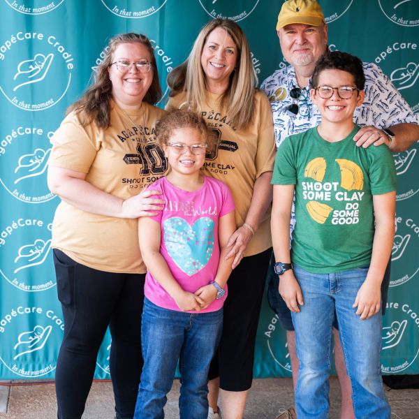 Family_posing_for_photo_at_event