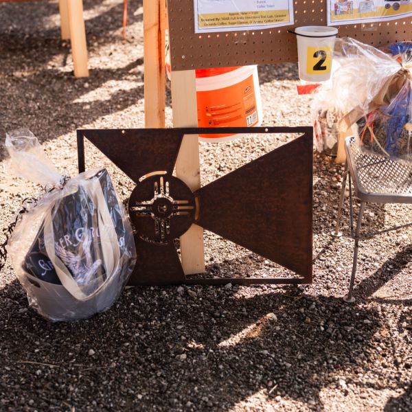 Food_table_under_tent_with_items_and_boxes