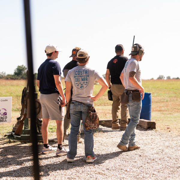 Four_men_at_outdoor_shooting_range