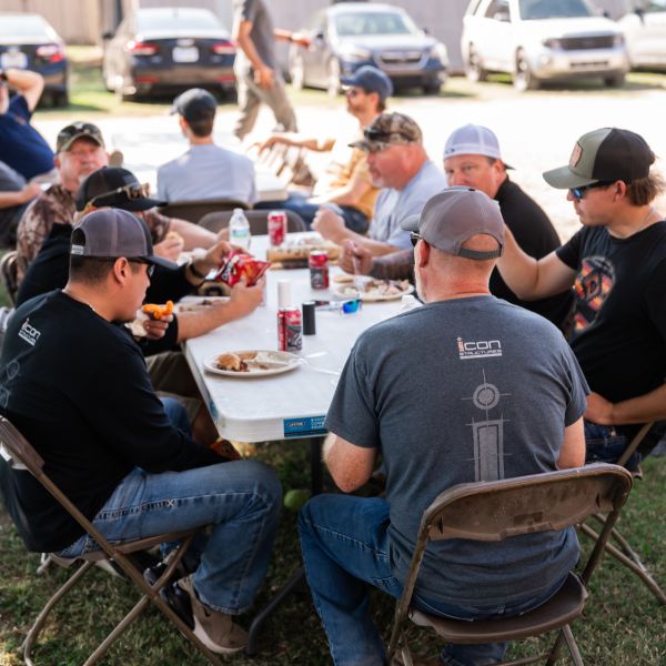 Hunters_gathered_around_picnic_table