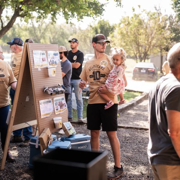 Man_placing_raffle_at_outdoor_event