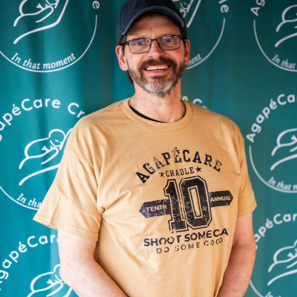 Man_standing_behind_sign