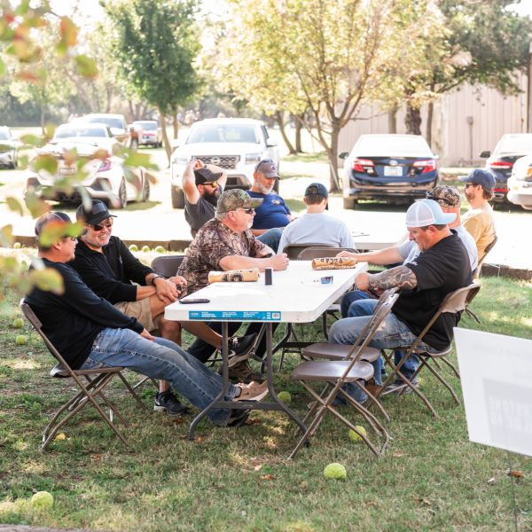 Men_gathered_around_sscdsg_outdoors