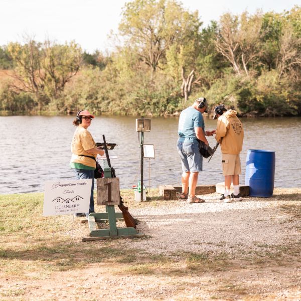 People_clay_shooting_by_river_bank