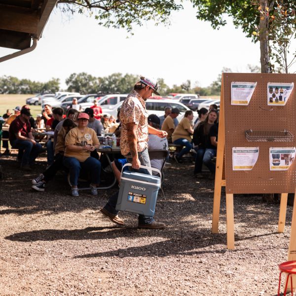 People_gathered_at_sscdsg_event_with_a_man_holding_a_cooler
