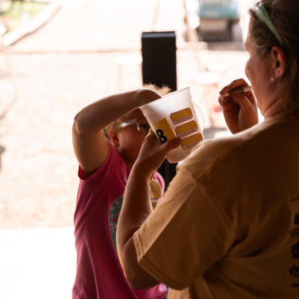 Woman_calling_raffle_number_from_cup