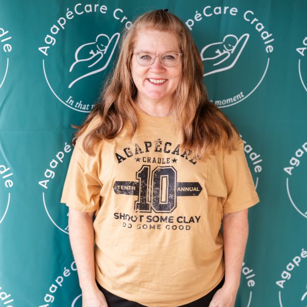 Woman_in_Yellow_Tshirt_smiling_at_camera